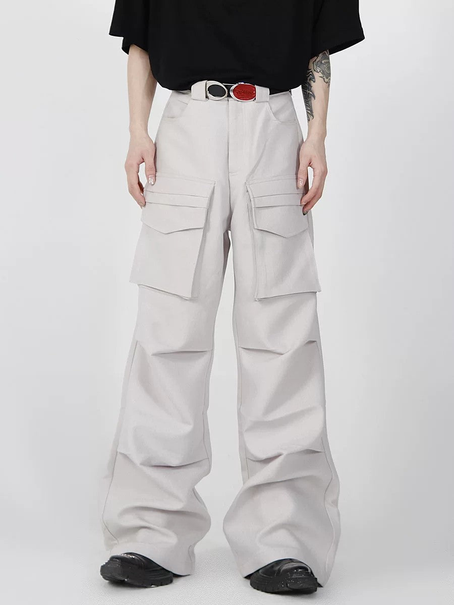 Model wearing black 3D multi-pocket baggy cargo pants in a street setting