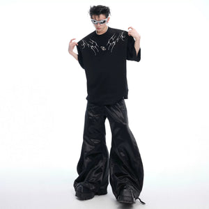 Three color variants of the spine embroidery tee: Black, White, and Gray