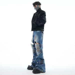 Detailed shot of armor inspired pleated knee cut-outs
