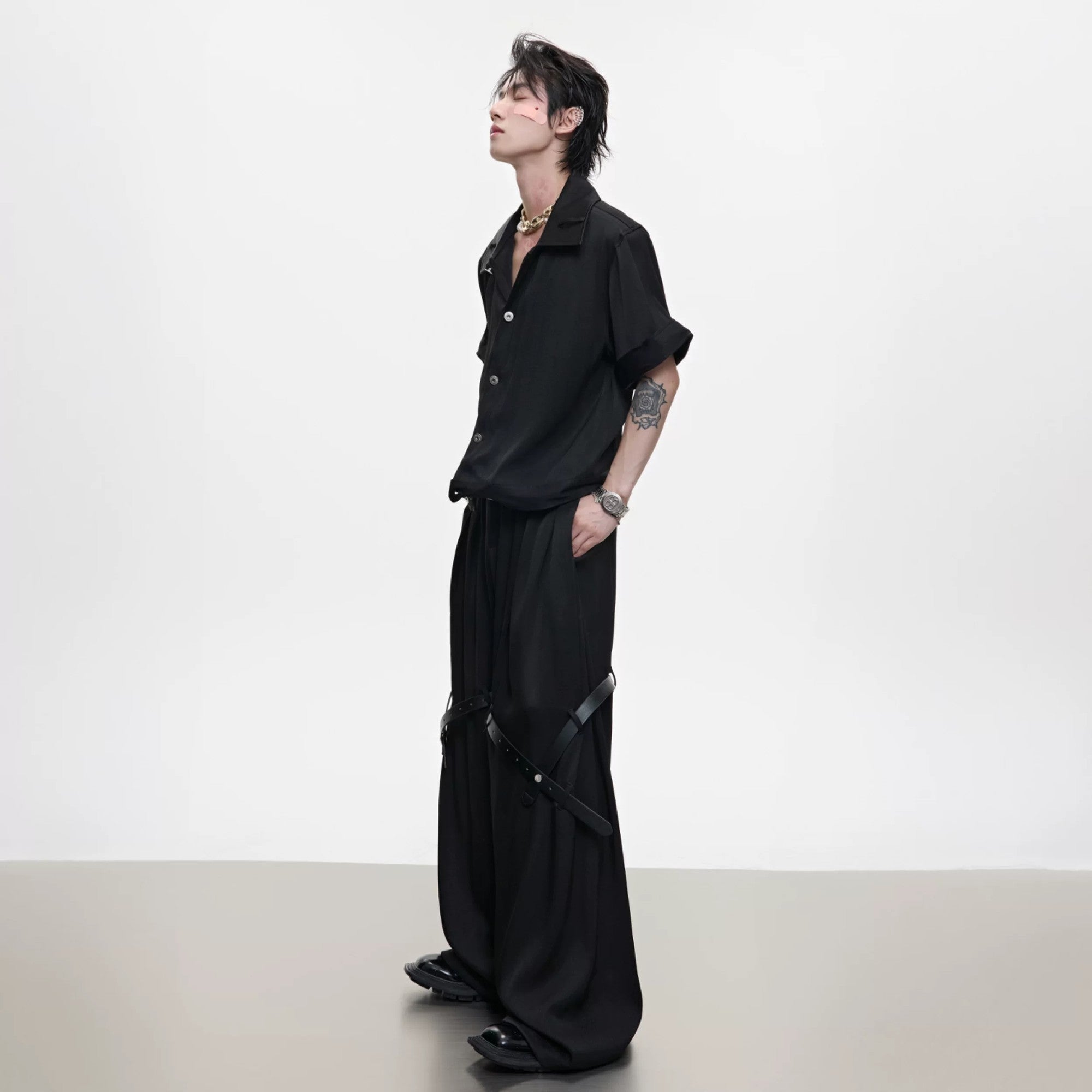 Close up of black twill texture deconstructed jacket with shoulder pads