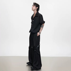 Close up of black twill texture deconstructed jacket with shoulder pads