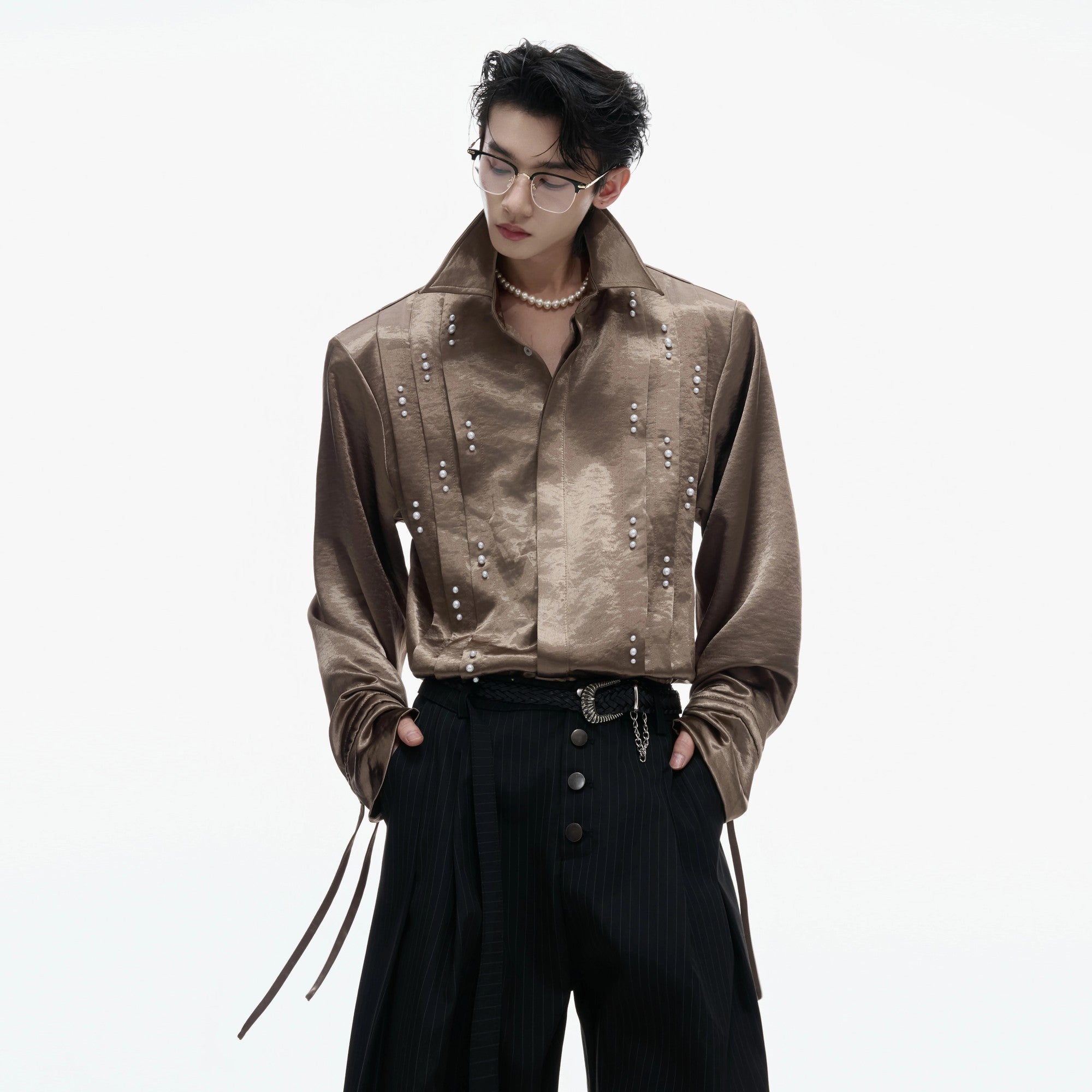 Close up of 3D pleats and pearl embellishments on the sleeve