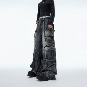 Side profile of black deconstructed cargo pants showing pocket details