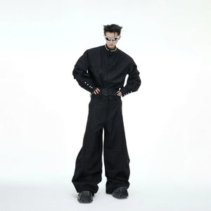 Model wearing oversized baroque pearl shirt in a street style setting