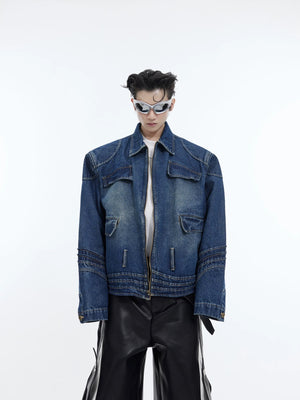 Front view of a blue deconstructed washed denim jacket with 3D paneling