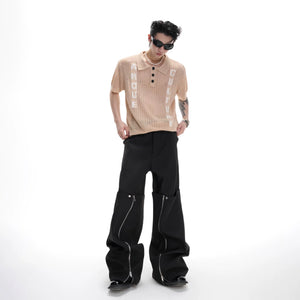 Close-up of black open-knit texture and jacquard lettering