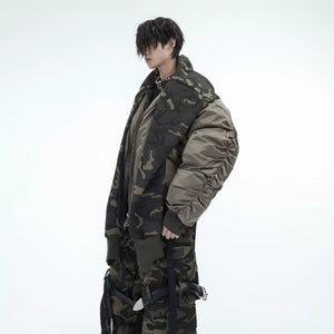 Model wearing beige camo patchwork flight jacket in urban setting