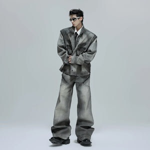 Close up of the boxy shoulder pads and zipper detail on denim jacket.