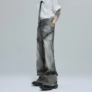 Macro shot of the heavyweight gradient wash denim fabric texture.