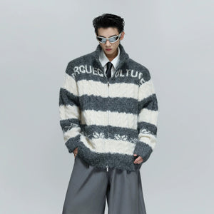 Close-up of the heavyweight wool blend chunky knit fabric texture.