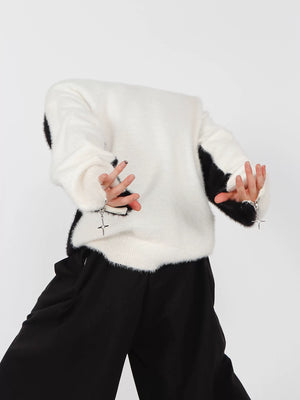 Male model wearing oversized contrast mohair crewneck in gray