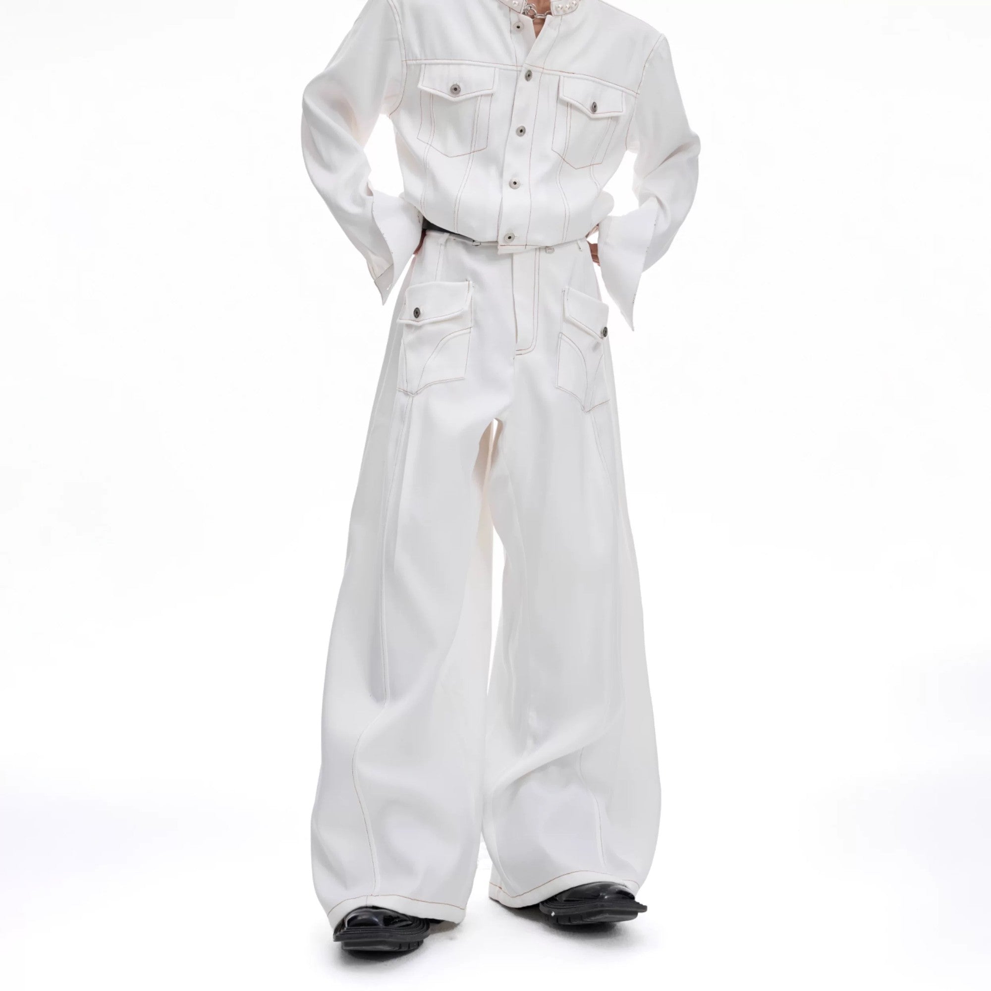 Close up of oversized utility pockets and contrast stitching on denim