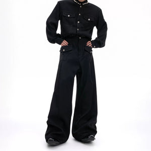 Unisex model wearing loose straight cargo pants in street setting