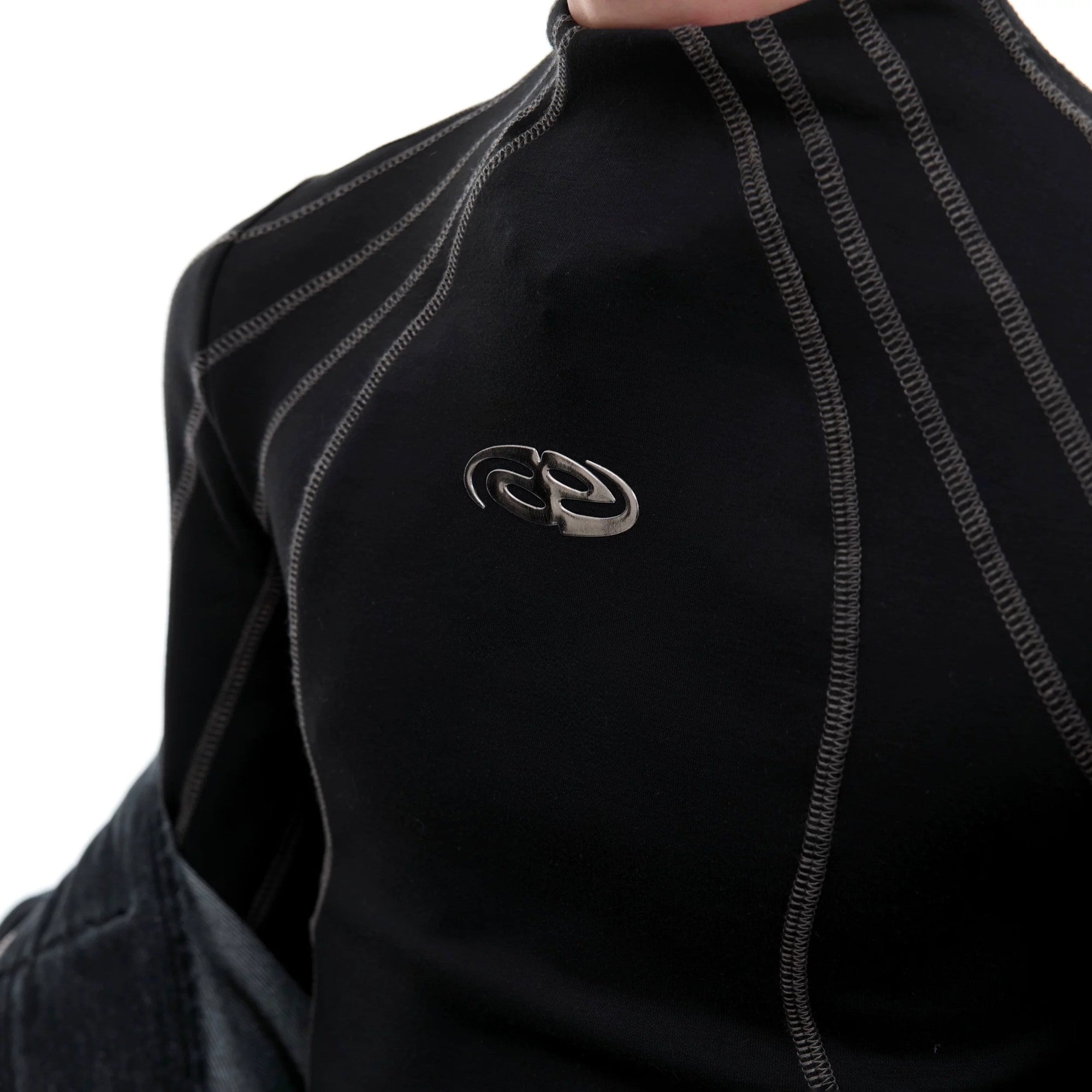 White mock neck slim fit long sleeve crop top with contrast stitching