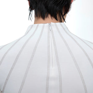 Close-up of premium metal hardware on a designer streetwear top