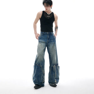 Lifestyle shot of model wearing curved cut baggy jeans in a city setting