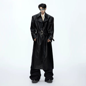 Front view of black croc-embossed wide-shoulder leather trench coat