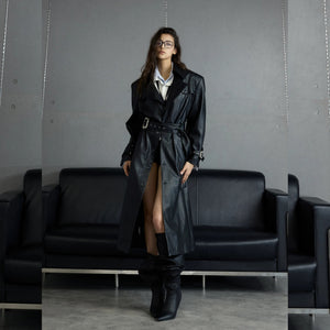 Back detail of deconstructed leather coat with cinched waist