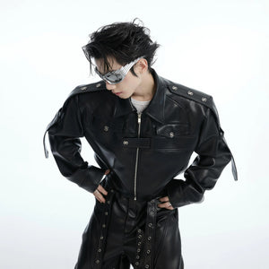 Close up of metal hardware and deconstructed stitching on a black biker jacket