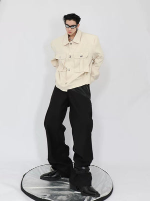 Male model wearing black cropped jacket with wide leg pants streetwear style