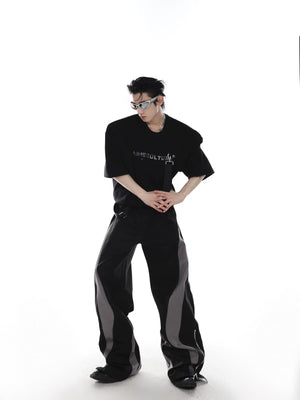 Side profile showing the structured padded shoulder and loose fit silhouette