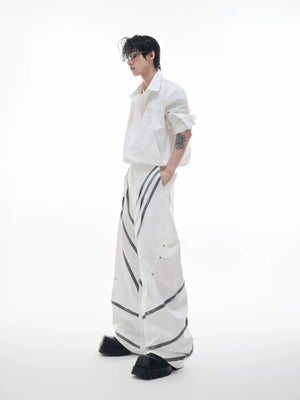 Back view of high-waist deconstructed trousers showing pocket detail