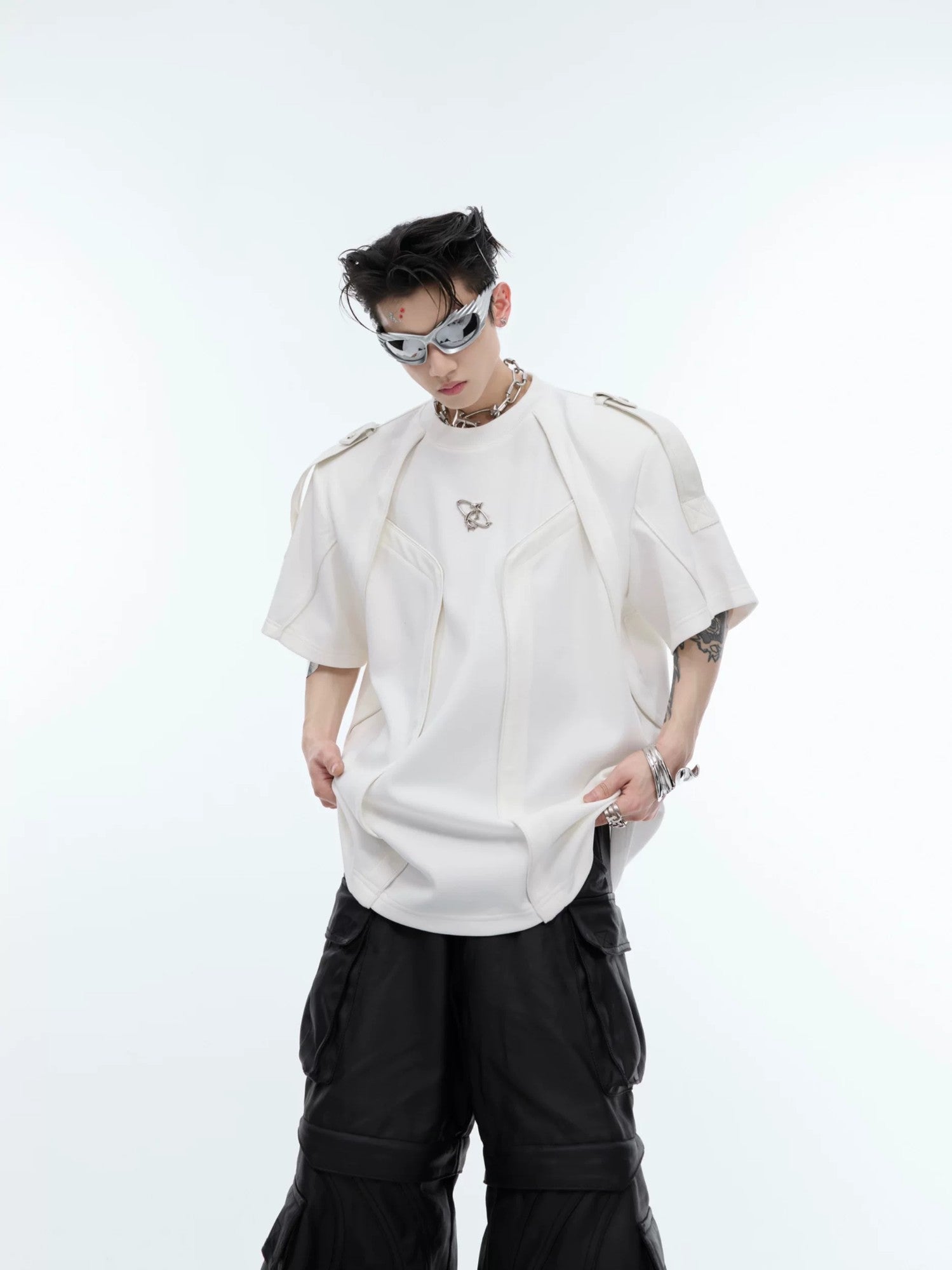 Close up of black deconstructed streetwear tee with 3D patchwork details