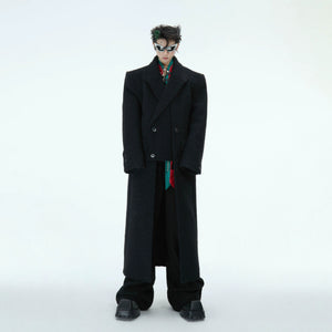 Front view of deconstructed asymmetrical woolen coat in black urban style