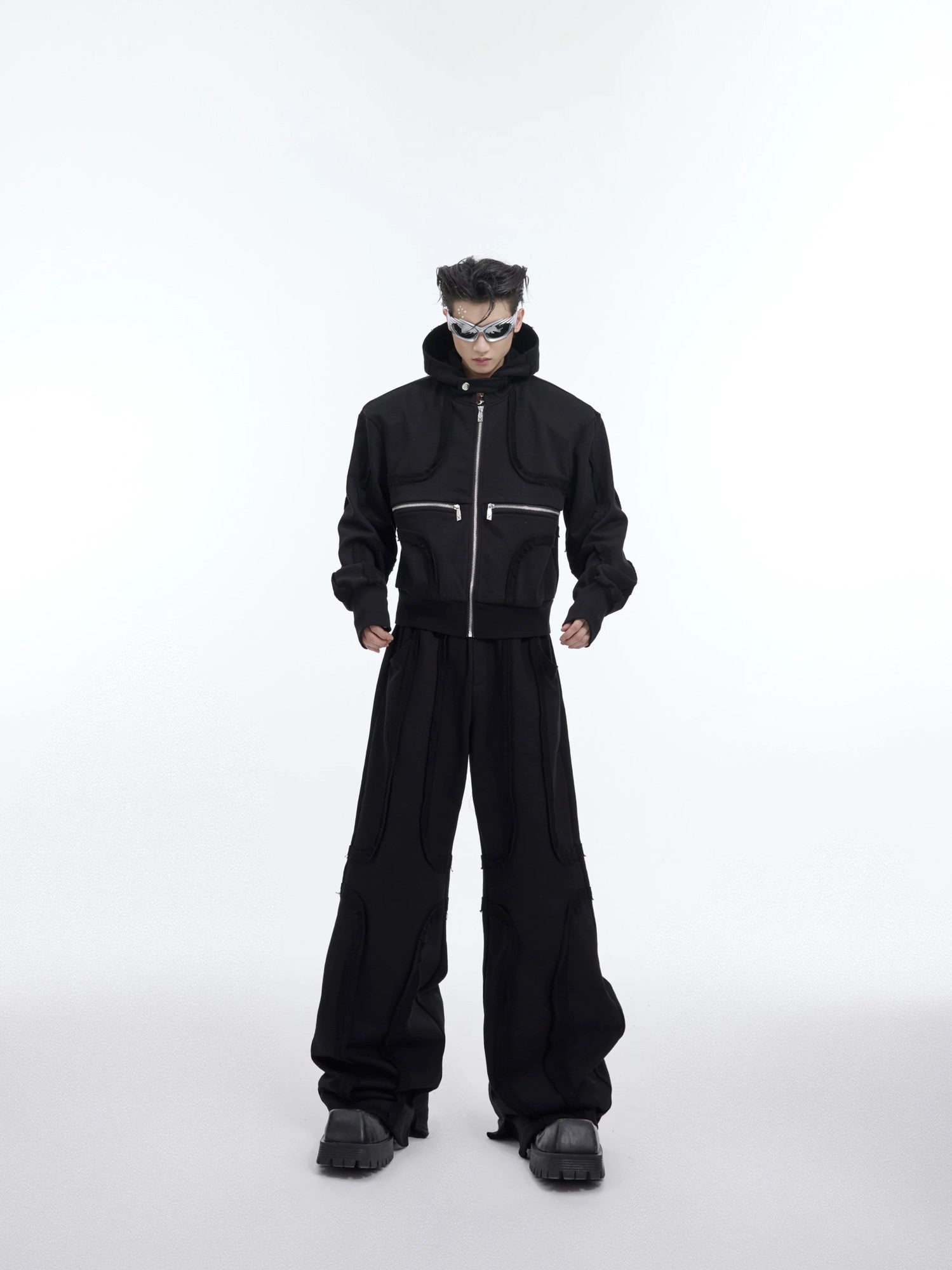 Red deconstructed cropped hoodie with shoulder pads and zipper details