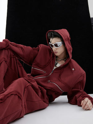 Man wearing black boxy deconstructed tracksuit set in urban setting