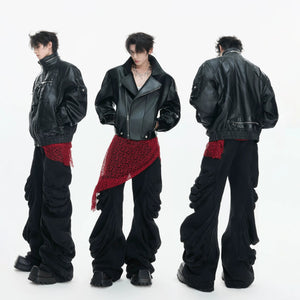 Detailed shot of custom metallic button and deconstructed waist design