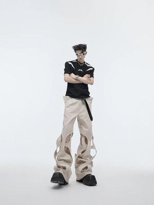 Model wearing black deconstructed pants in a street setting