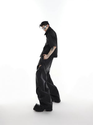 Model wearing deconstructed cutout jeans in a street fashion setting