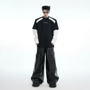 Model wearing the gray deconstructed tee in an urban setting