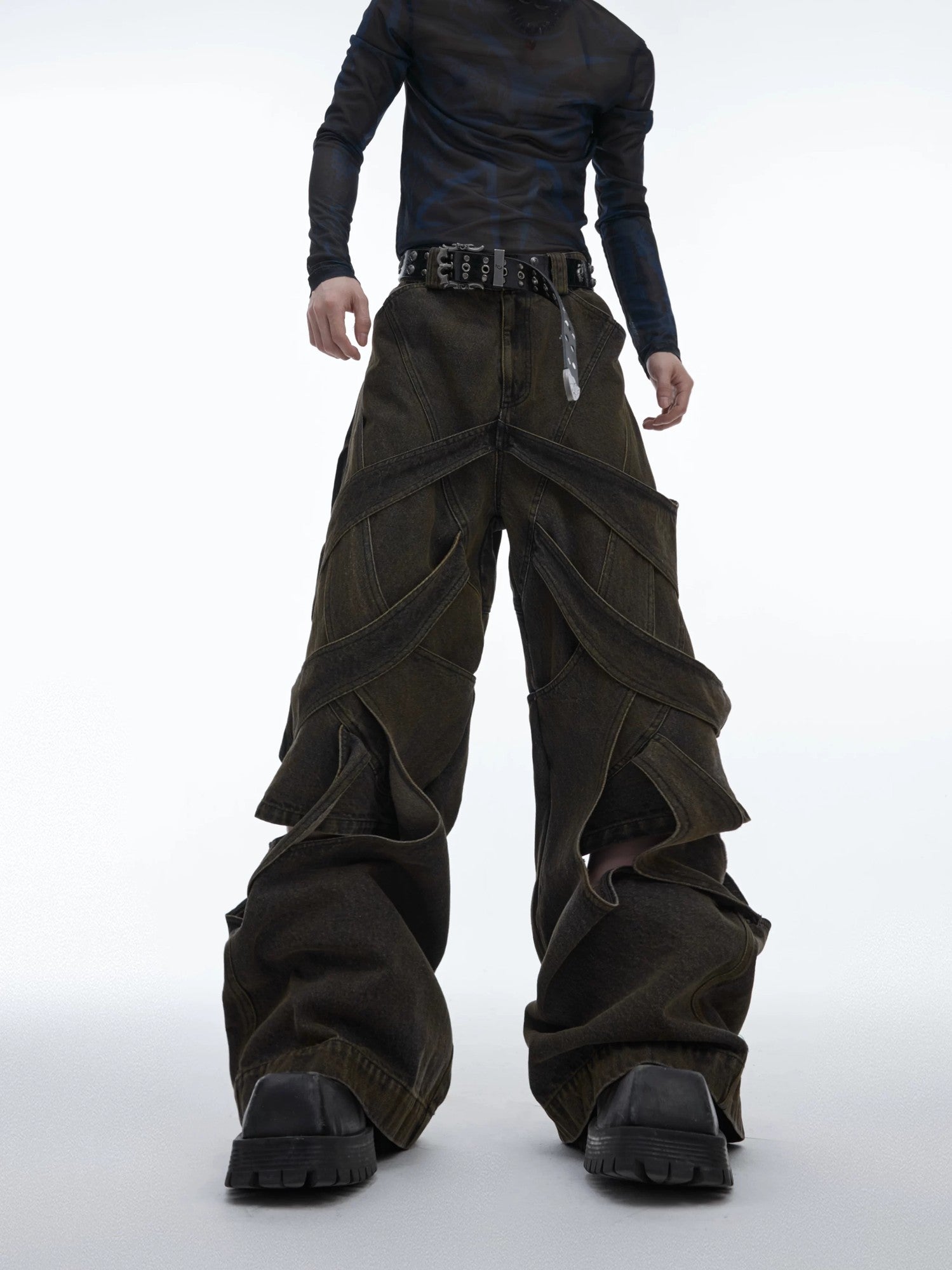 Close-up of hand-distressed cutout details on denim pants