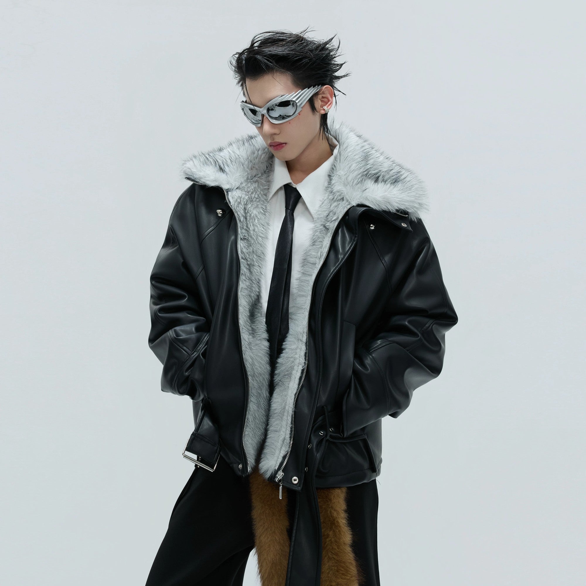 Front view of the deconstructed faux leather jacket with brown fur collar