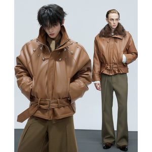 Close-up of metal pearl and stud hardware on a white leather jacket