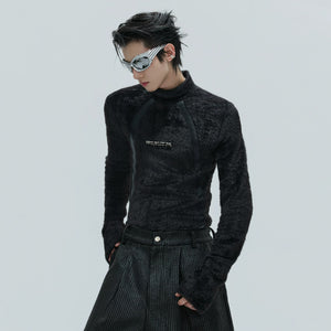 Front view of black deconstructed plush mock neck top with leather accents