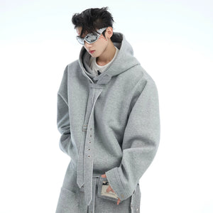 Detail of custom metal buttons and laser-engraved tags on pocket