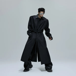 Back profile of a loose fit deconstructed streetwear coat