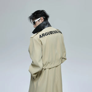 Full body shot of a deconstructed trench coat styled with baggy pants