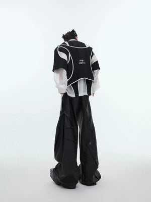 Model wearing oversized deconstructed sweatshirt with sharp shoulder pads