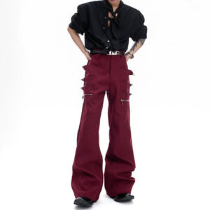 Front view of black gothic flared pants with metal zipper details