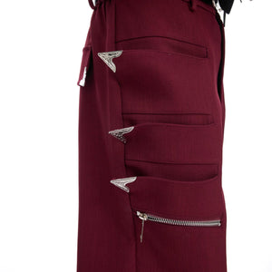 Back view of red deconstructed pants showing flared fit