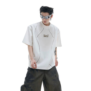 Back view of black deconstructed tee showing premium spliced fabric details