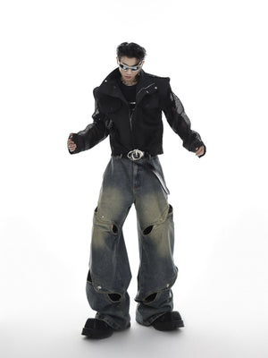 Close-up of the metal button and hollow-out design details on punk jeans