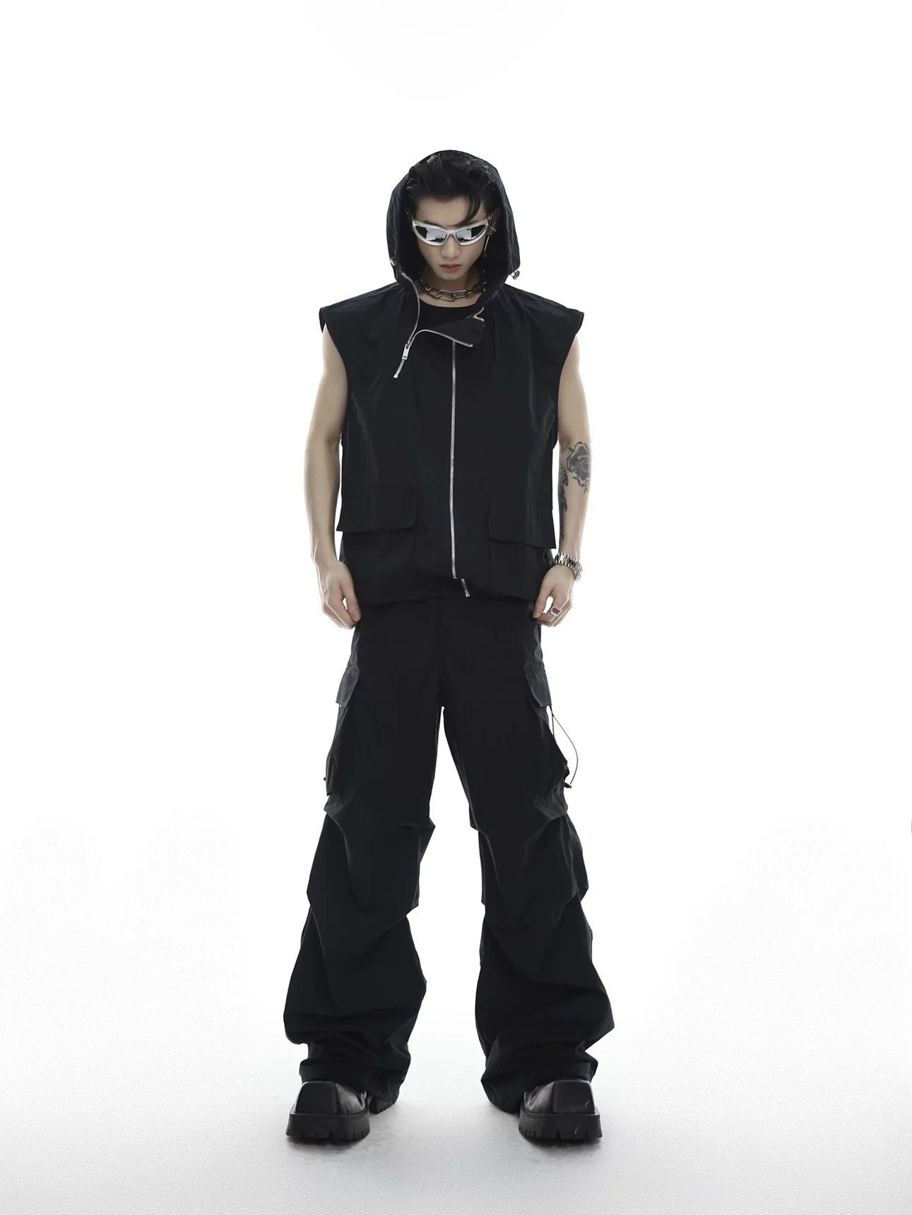 Front view of the black avant-garde deconstructed vest and cargo pants set