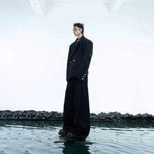 Close up of metal button detailing on a streetwear blazer