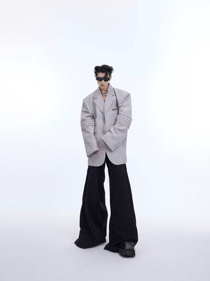 Street style outfit featuring a liquid shine deconstructed suit jacket