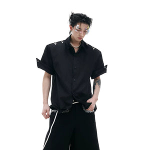 Front view of white deconstructed short sleeve shirt with metal buckle